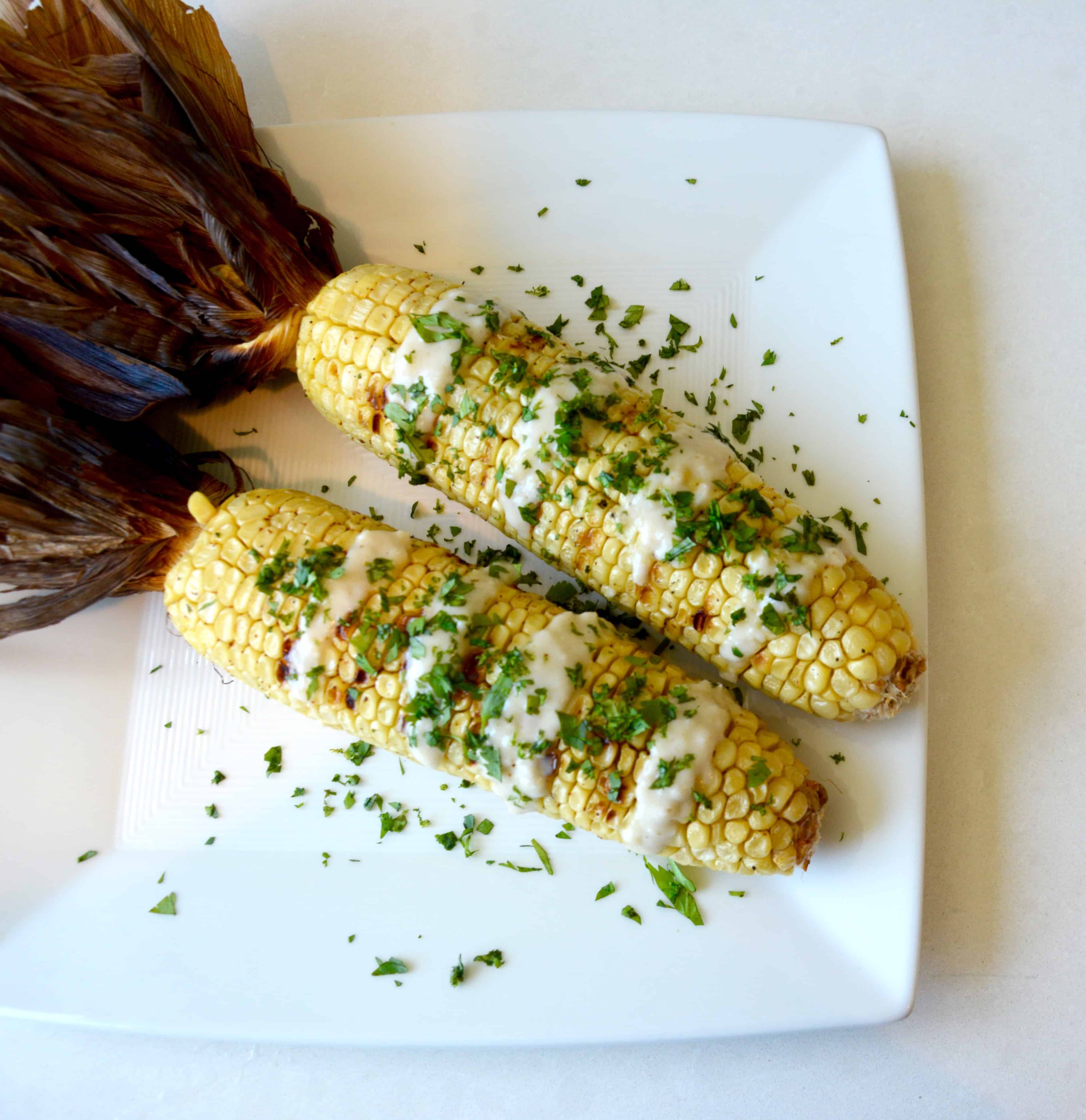 Grilled Corn on the Cob with Coconut Lime Glaze - pralinesandgreens.com